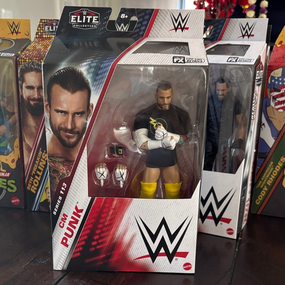 WWE Elite CM Punk Figure with Yellow and Black Gear